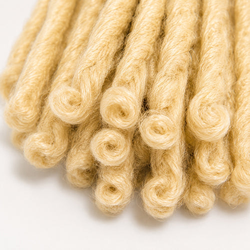 Close-up of curled ends on 3X Soft Bread crochet faux locs color 27/613