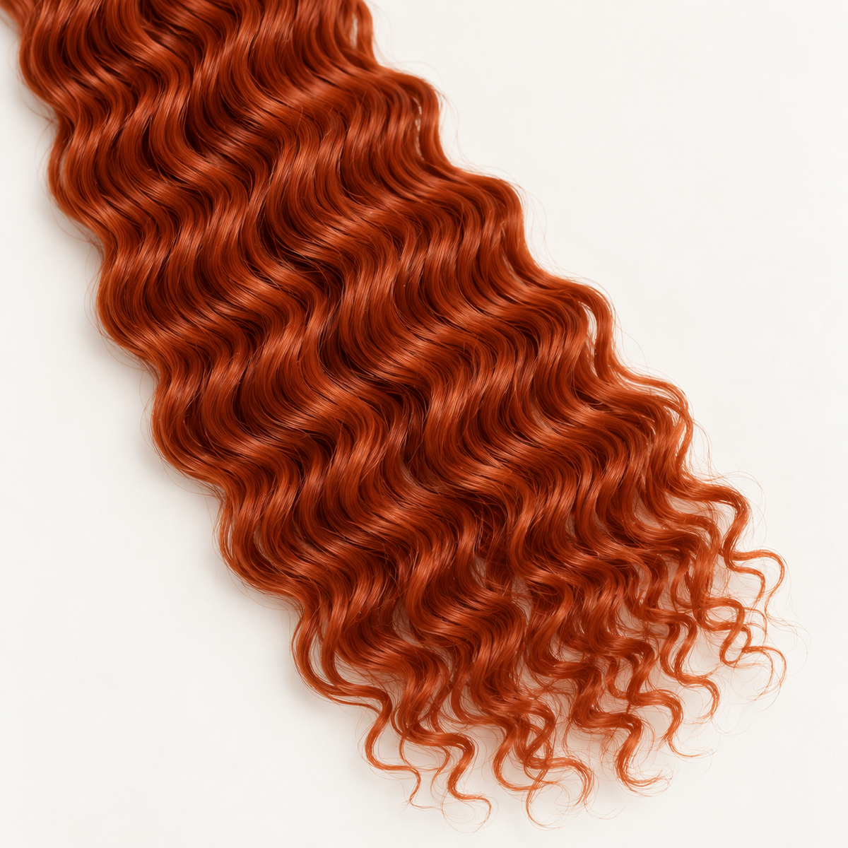 Close-up of 350 copper deep wave curl texture for boho braids