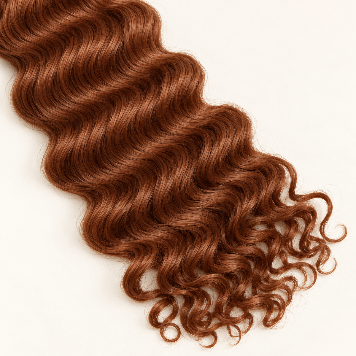 Close-up of 30 auburn deep wave texture and loose curly ends