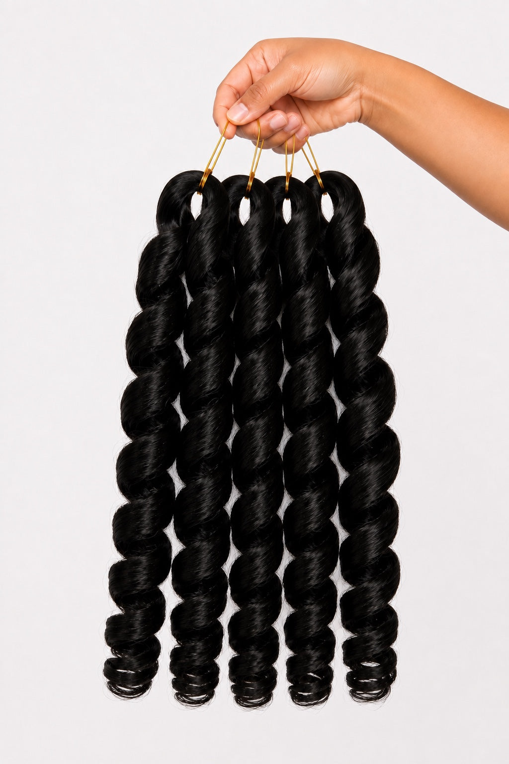 Hand holding four Source Italy Curly 6X Crochet Braid bundles in color 2
